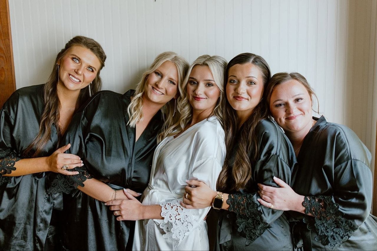 Bride and her bridal party in the getting-ready suite